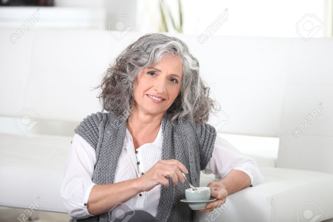 12218348-Woman-sitting-on-the-floor-with-a-cup-of-coffee-Stock-Photo-woman-hair-gray