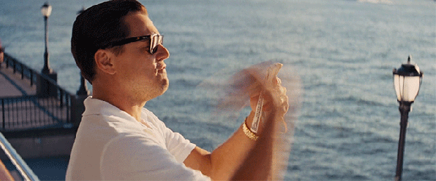 Leonardo DiCaprio flinging money off a boat