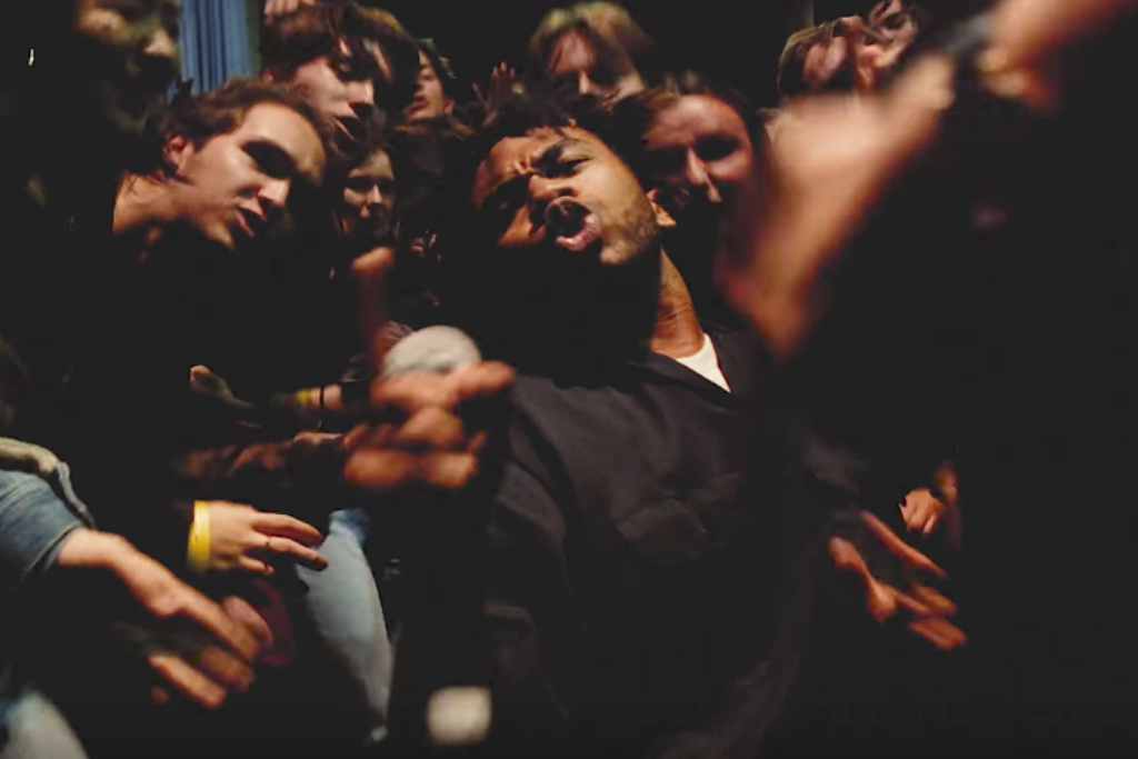 Brockhampton's Kevin Abstract dances in a crowd at a Sydney cinema in new music video for 'New Orleans'