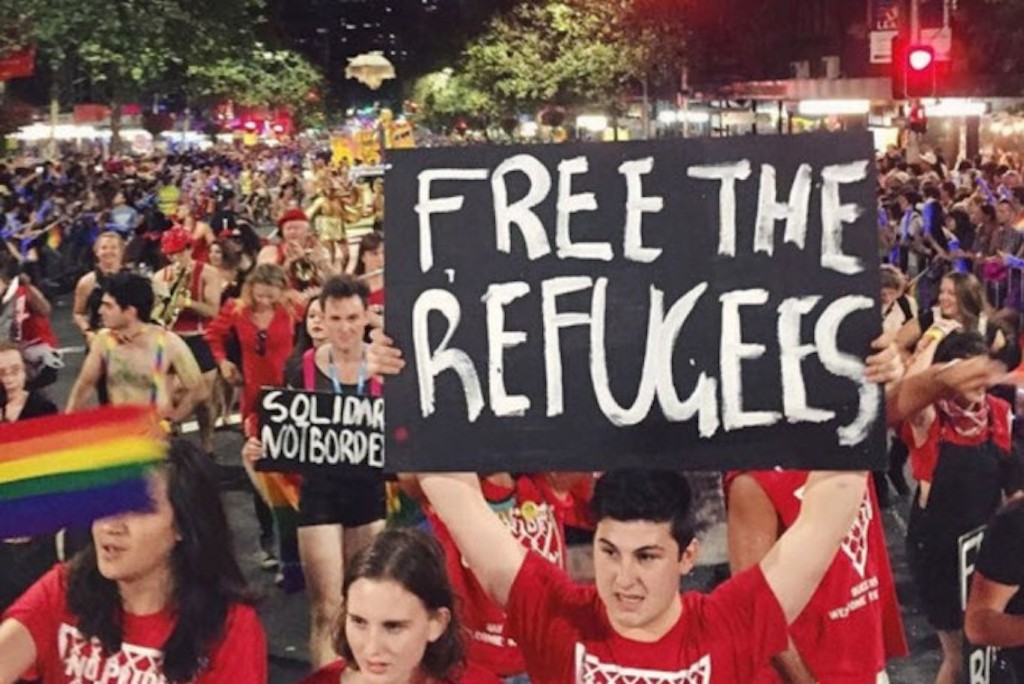 Pride In Protest holding pro-refugee banners at 2015 Sydney Gay and Lesbian Mardi Gras