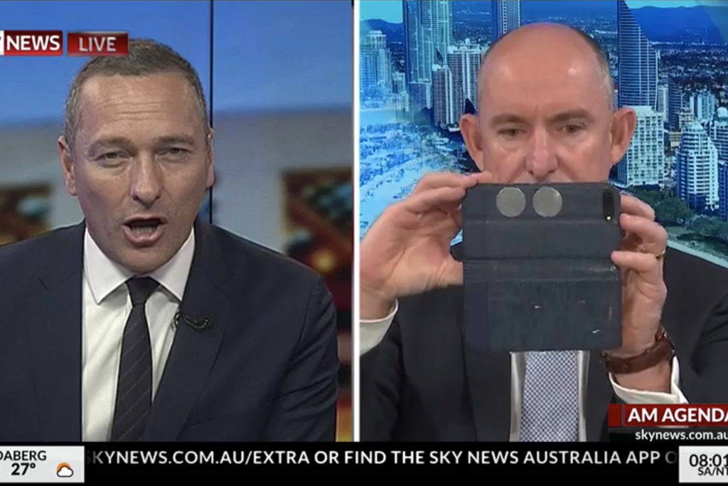 stuart robert taking a selfie when he's meant to be in a live interview on Sky News