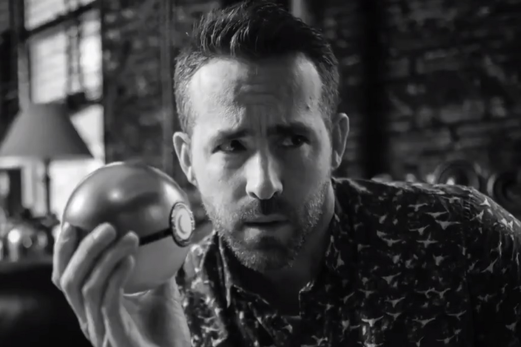 Ryan Reynolds holding a Pokeball in a promo trailer for Detective Pikachu