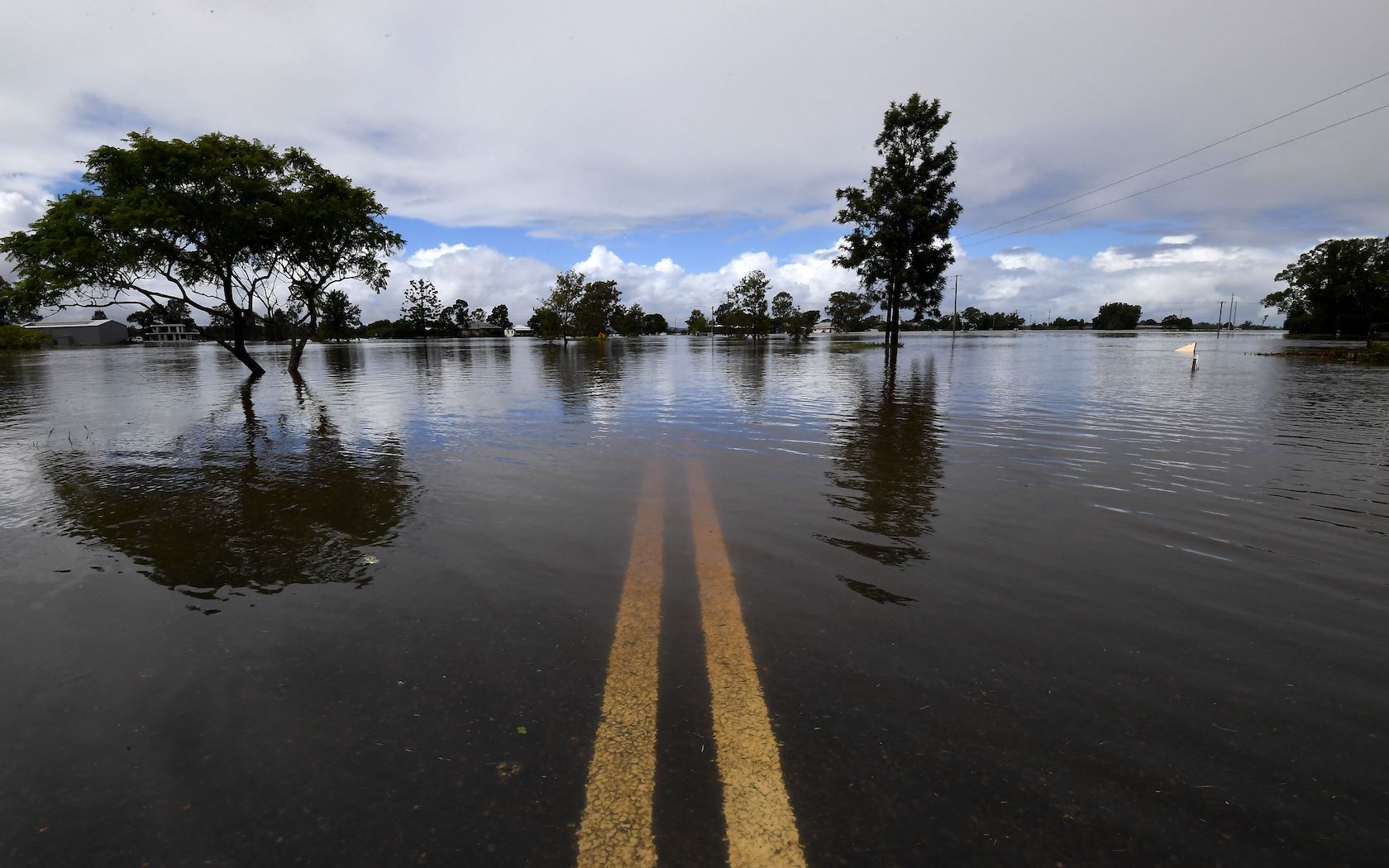 TOPSHOT - A general view of a flooded street is seen in Lawrence, some 70 kms from the New South Wales town of Lismore, on March 1, 2022. (Photo by SAEED KHAN / AFP) (Photo by SAEED KHAN/AFP via Getty Images)