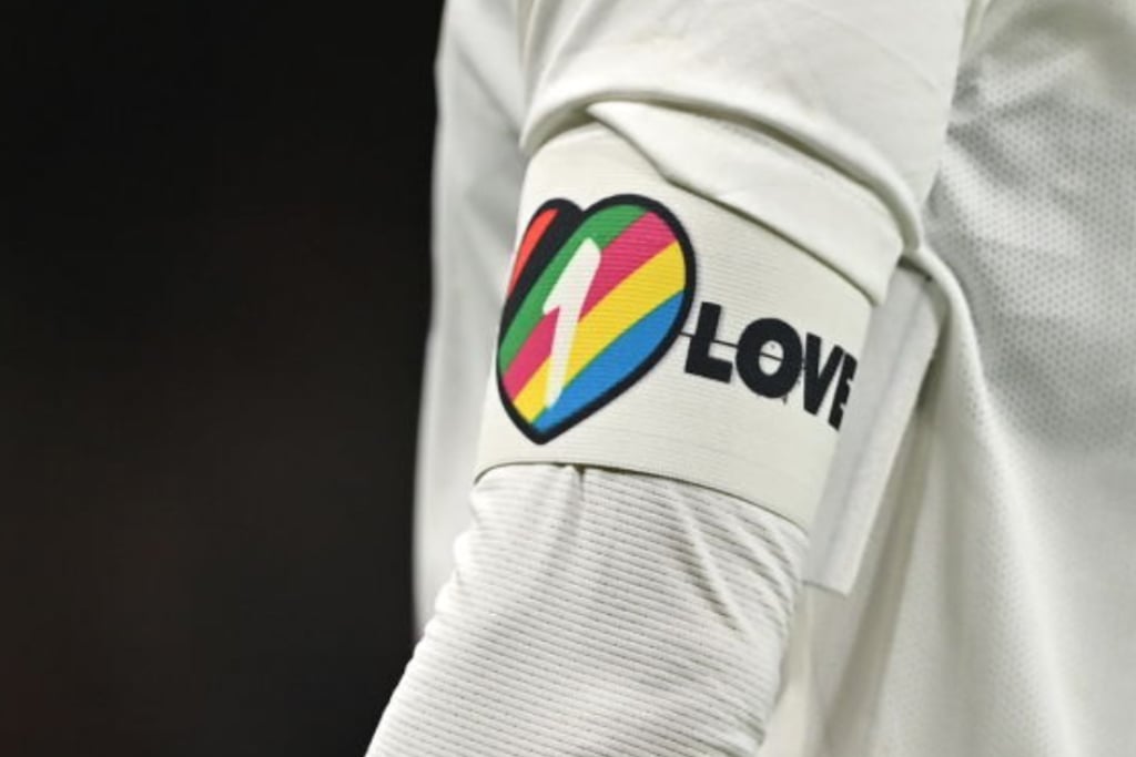 Close up of 'one love' band being worn by a long-sleeved athlete