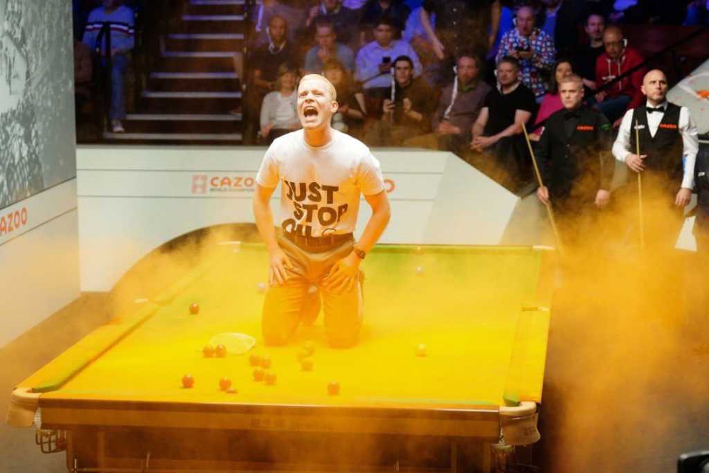 A protester interrupting a game at the World Snooker Championship 2023