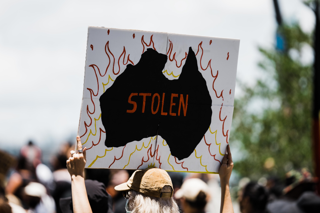 Voice to parliament Indigenous black lives matter rally protest sign