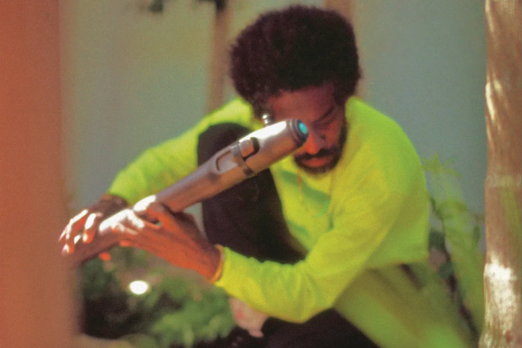 andre 3000 holding a flute on the cover of his album new blue sun